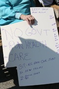 i'm sure the older lady holding this sign didn't mean the care she currently got