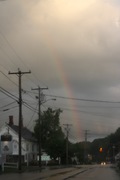 a rainbow coming down front street in manchester, nh