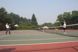 hugh getting some tennis lessons (photograph by nicole michaud)
