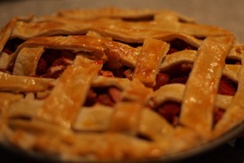 lattice strawberry rhubarb pie with an egg wash